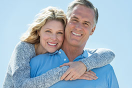 A couple smiling. Link to Life Stage Gift Planner Under Age 60 Situations.