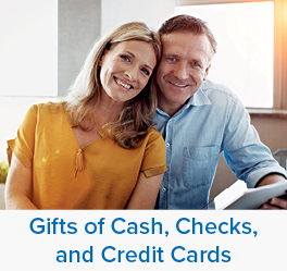 A couple smiling. Links to Gifts of Cash, Check, and Credit Cards