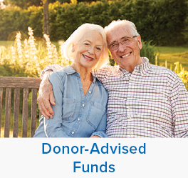 A couple smiling. Links to Donor-Advised Funds