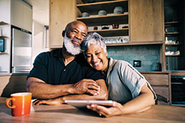 A couple smiling. Link to Life Stage Gift Planner Ages 60-70 Situations.